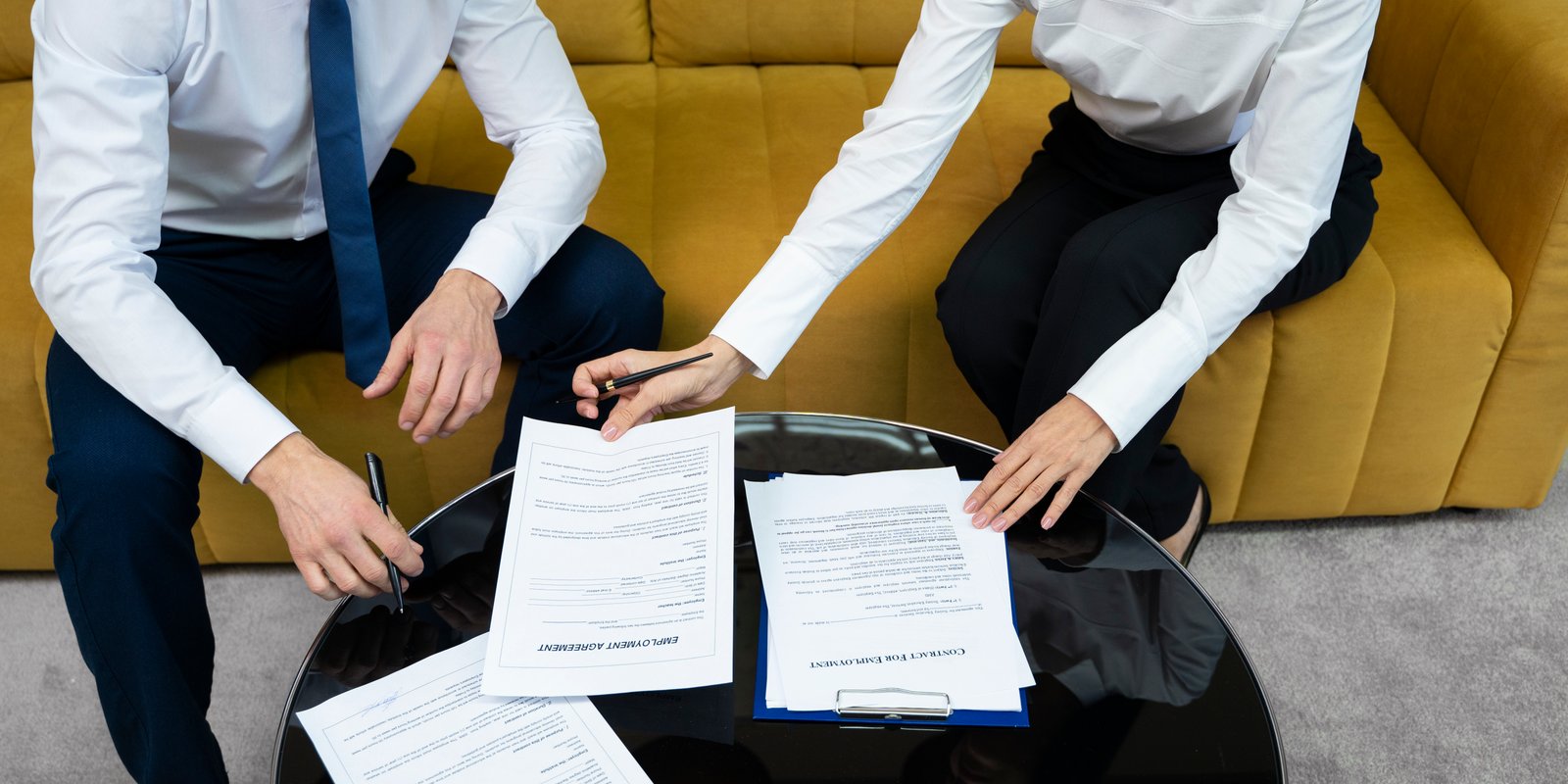 Insurance dispute lawyer reviewing denied claim with client