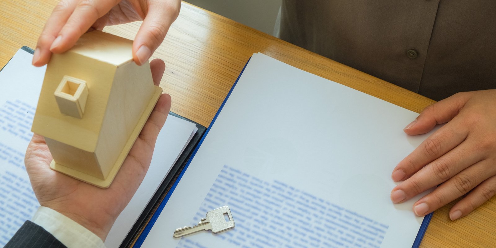Real estate lawyer reviewing property documents with client