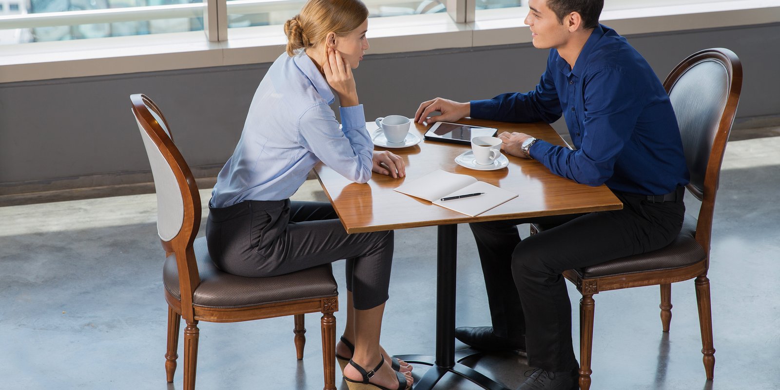 Professional meeting with client about wrongful termination case